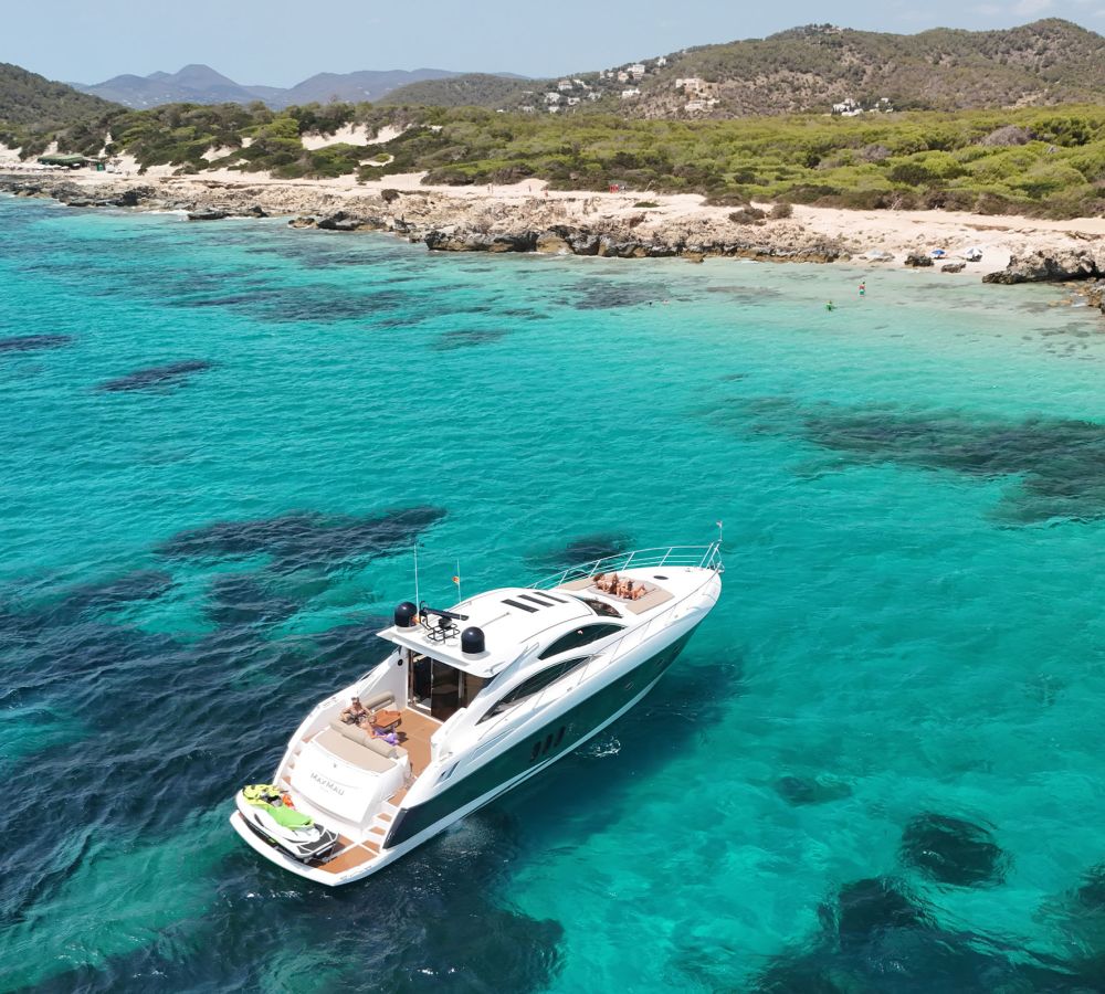 Boat anchored in a cove in Ibiza